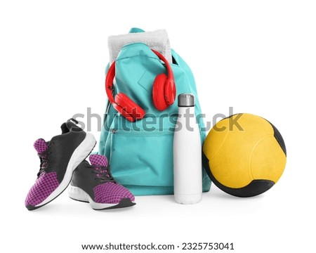 Backpack with sports equipment on white background Royalty-Free Stock Photo #2325753041