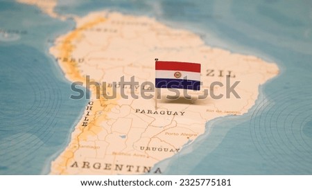 The Flag of Paraguay on the World Map. Royalty-Free Stock Photo #2325775181