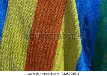 Close-up photo of a towel in rainbow colors