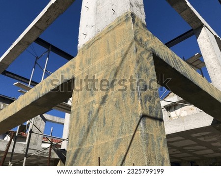 Building columns are protected against earthquakes with carbon fiber material.. Carbon fiber fabric.. Royalty-Free Stock Photo #2325799199