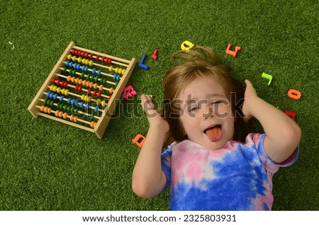Little boy with colorful abacus learning counting. Kids study and learn. Preschool kid writing and reading on hebrew. Hebrew letters. Learning Hebrew. Kindergarten, school in Israel Royalty-Free Stock Photo #2325803931