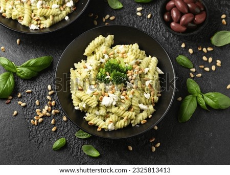 Creamy broccoli feta cheese pasta with pine nuts. Healthy food Royalty-Free Stock Photo #2325813413