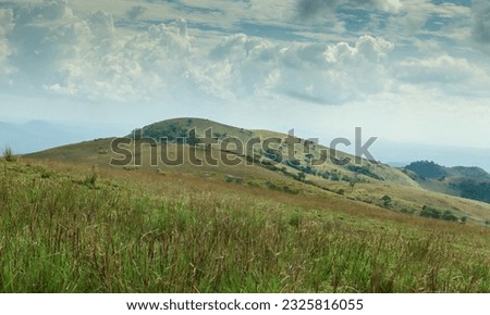 Mysuru, Karnataka, India-May 3 2023; A Dramatic picture of Heavenly mountain range with clouds at a Picturesque locale of Western ghats in India.
