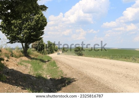 A car driving on a dirt road