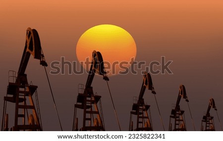 Oil pump jack under the sunset sky
