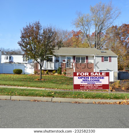 Real Estate For Sale Open House Welcome Sign suburban bungalow home autumn day residential neighborhood blue sky USA