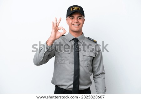 Young caucasian security man isolated on white background showing ok sign with fingers Royalty-Free Stock Photo #2325823607