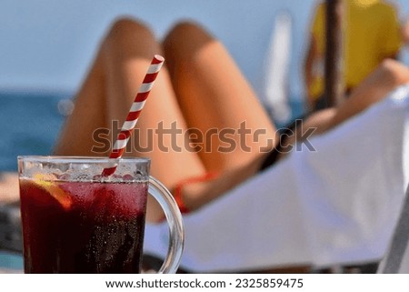 sangria worm by the sea, summer in spain
