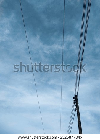 blue sky and tidy electric wires