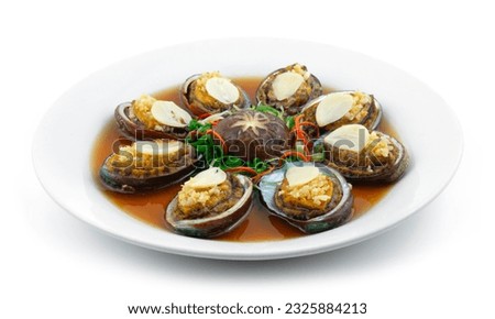 Steamed Abalone with Garlic decoration Mushroom Chinese New year menu Style sideview Royalty-Free Stock Photo #2325884213