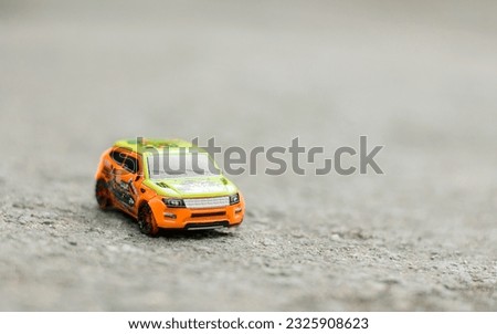 Small toy racing car on the ground
