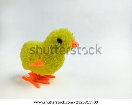 walking chicken toy for kids. little baby chicken toy isolated on white background.