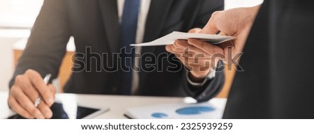 Good job, asian manager man giving financial reward in an envelope, business letter extra salary to company employee, caucasian male worker office hand received premium bonus, getting cheque from boss Royalty-Free Stock Photo #2325939259
