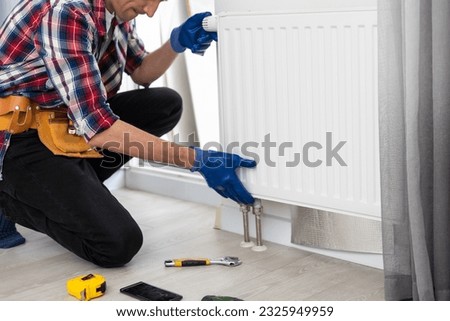 Heater Installation And Repair In House. Heat Pump Services Royalty-Free Stock Photo #2325949959