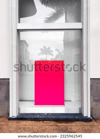 Bright rectangular advertising lightbox in the front window of a building in a retail store for a template advertisement 