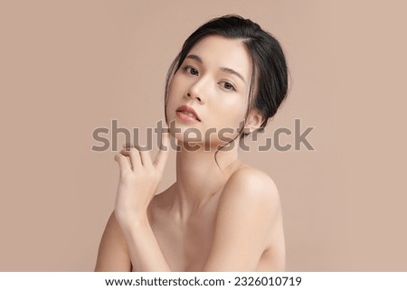 Beautiful young asian woman with clean fresh skin on beige background, Face care, Facial treatment, Cosmetology, beauty and spa, Asian women portrait. Royalty-Free Stock Photo #2326010719