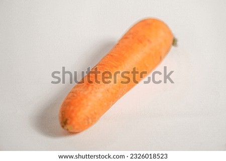 Fresh organic carrot isolated on white background
