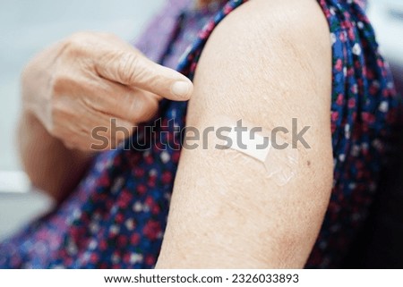 Asian elder senior woman getting vaccine for protect corona virus.
