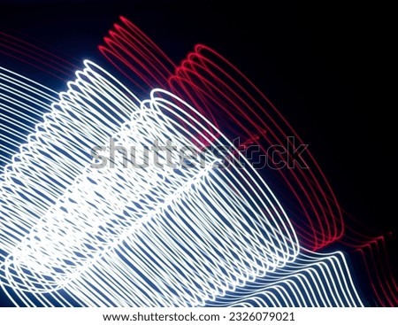 Long exposure light painting photography, abstract background, curvy lines of vibrant neon metallic against a black background