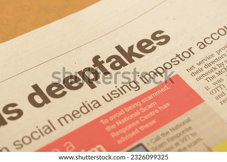A close-up view of the wording "Deepfakes" prominently displayed on a newspaper Royalty-Free Stock Photo #2326099325