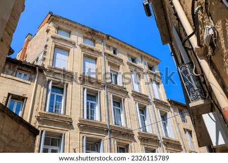 Multi-storey dilapidated old residential building in downtown Montpellier in France Royalty-Free Stock Photo #2326115789