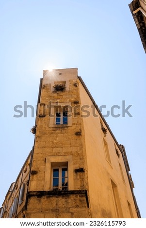 Multi-storey dilapidated old residential building in downtown Montpellier in France Royalty-Free Stock Photo #2326115793
