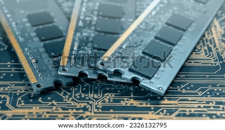 computer memory modules on background of black printed circuit board with golden wires Royalty-Free Stock Photo #2326132795