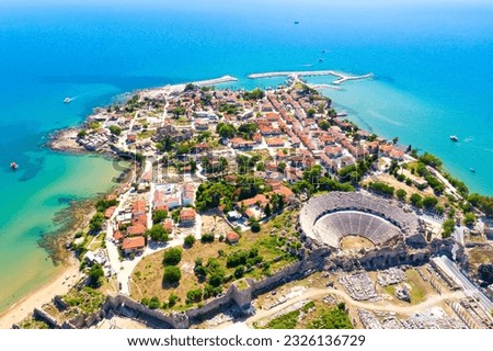 Aerial top drone view of ancient Side town with amphitheater, Antalya Province in Turkey. Royalty-Free Stock Photo #2326136729