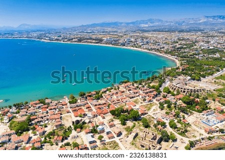 Aerial top drone view of ancient Side town with amphitheater, Antalya Province in Turkey. Royalty-Free Stock Photo #2326138831