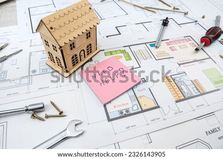 Pictures and blueprints plans for home decoration with tools color sampler for repair on table. repair. house project