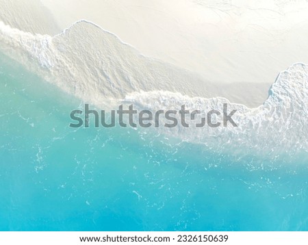 Aerial view with beach in wave of turquoise sea water shot, Top view of beautiful white sand background Royalty-Free Stock Photo #2326150639