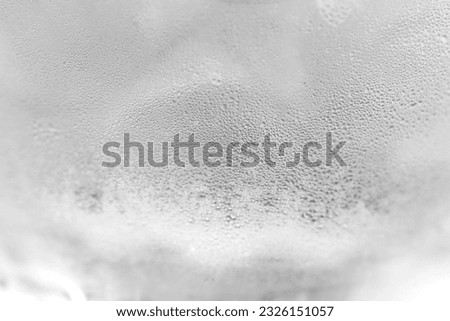 Ice cold glass. Water vapor on cold glass. Fresh water with ice cubes, background. Covered with water drops condensation. Royalty-Free Stock Photo #2326151057
