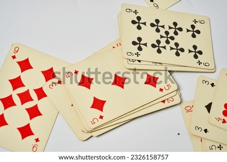 Old playing cards on a white background                               