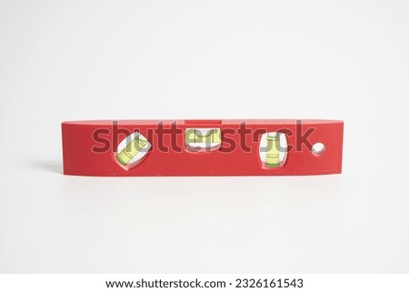  Red spirit level on a white background                              