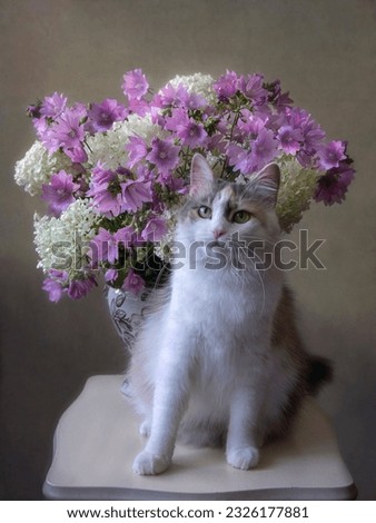 Adorable cat on the background of a beautiful bouquet