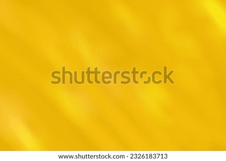 A gold background with a small light on top