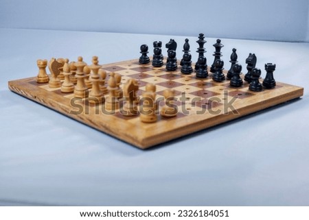 Wooden chessboard, chess figures, game of kinds
