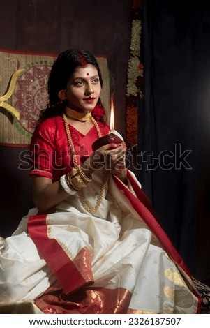 Durga Puja Look Photo-shoot based on agomoni Festival with ethnic look.like A face of Hindu goddess Durga.