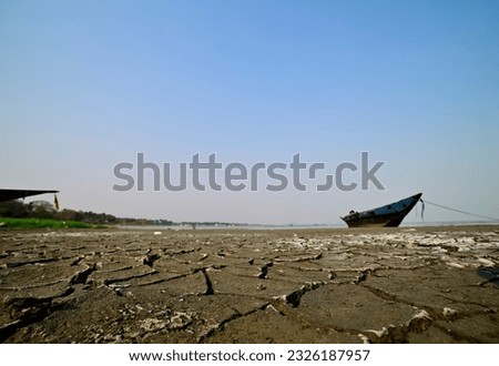 View of parched lake bed of Lake Chilika in summer season, India. Royalty-Free Stock Photo #2326187957