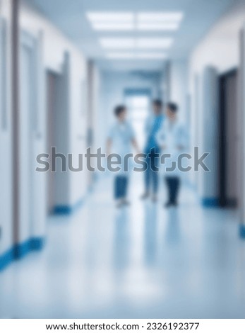 doctors talking in an empty hospital corridor, a blurry hospital corridor Royalty-Free Stock Photo #2326192377