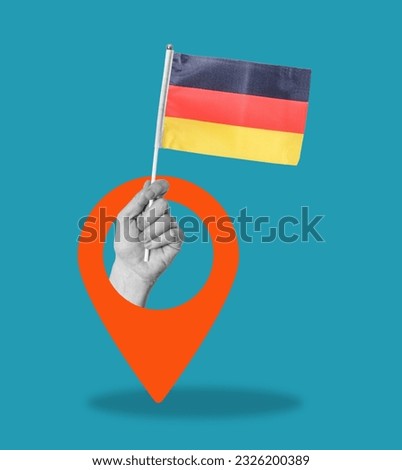 Art collage, hand with German flag on blue background with navigation sign. Concept of navigation and placement.