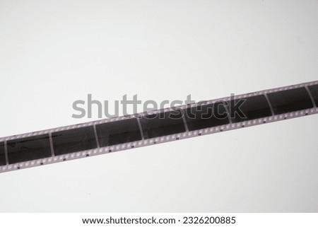  Analog camera film on a white background
                              
