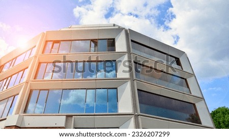 New apartment building with glass balcony terraces of very modern architecture.