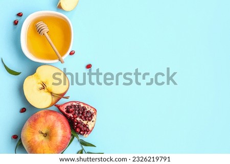 Composition with bowl of honey fruits on color background. Rosh hashanah (Jewish New Year) celebration Royalty-Free Stock Photo #2326219791