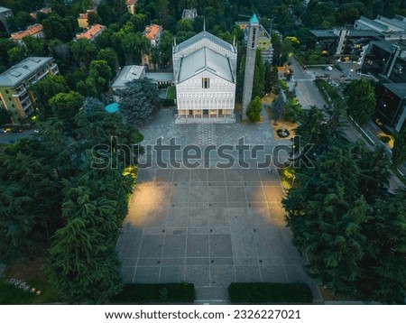 Aerial view Parish of Santa Barbara in San Donato Milanese. Italy. Lombardy. Church in Italy evening aerial view. 