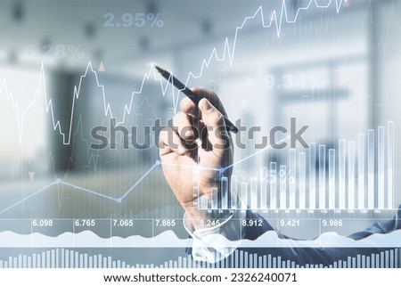 Multi exposure of businessman hand with pen working with virtual creative financial chart hologram on blurred office background, research and analytics concept