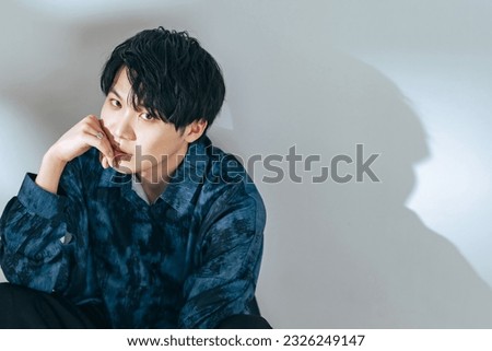 Fashion portrait of Asian boy. Genderless makeup. Korean makeup. Men's cosmetics.