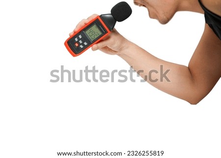 Asian man hand holding sound level meter on white background,sound meter holding Royalty-Free Stock Photo #2326255819