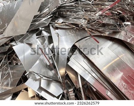 Aluminium sheet off cuts from a manufacturing process in a heap Royalty-Free Stock Photo #2326262579