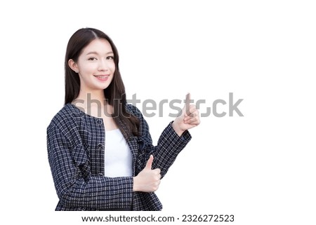 Asian professional working woman who wears black suit with braces on teeth is pointing hand to present as thump up isolated on white background. Royalty-Free Stock Photo #2326272523